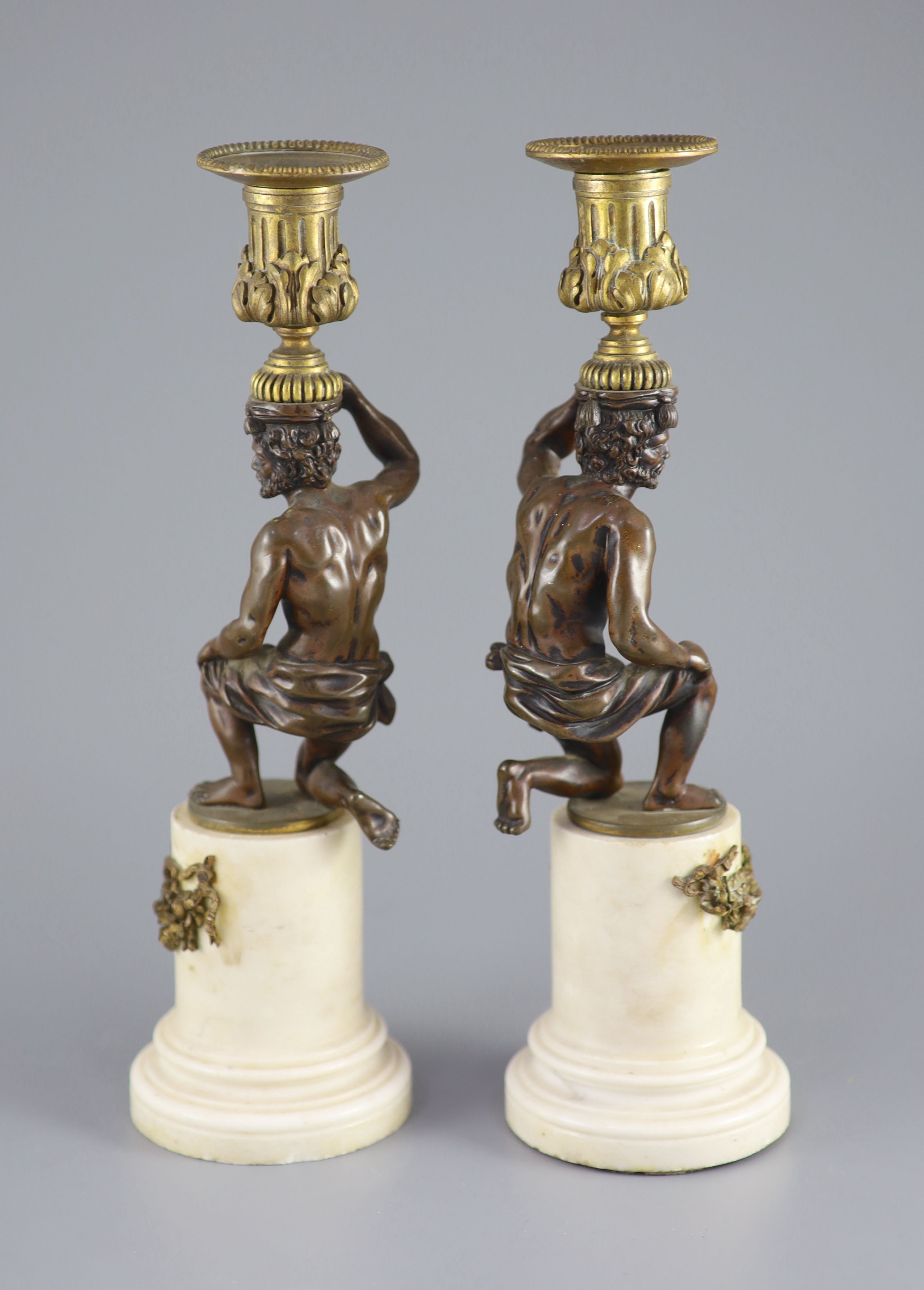 A pair of 19th century bronze and ormolu figural candlesticks, 33cm high.